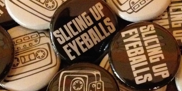 New at the merch table: Slicing Up Eyeballs’ cassette-themed buttons — plus stickers